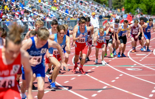 athletes line up on track